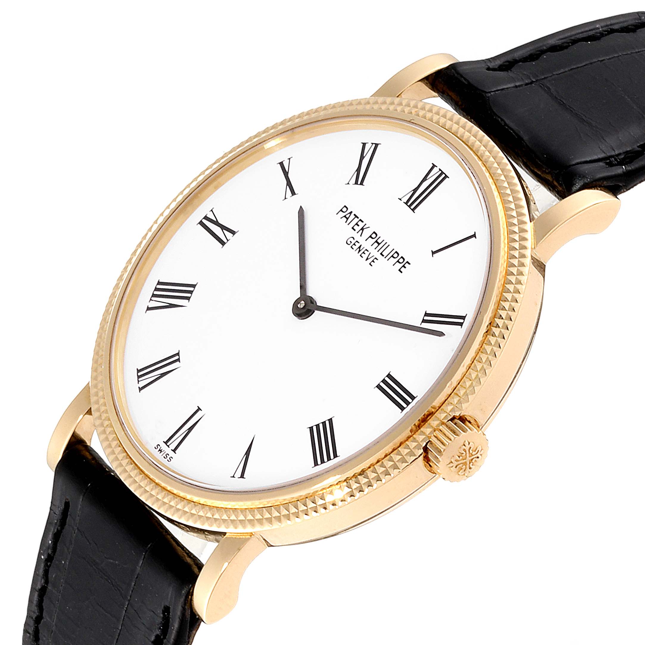 The image shows a Patek Philippe Calatrava 5120J Men's Yellow Gold White Dial 5120J Men's Yellow Gold White Dial watch at an angle, highlighting the face, crown, and black leather strap.