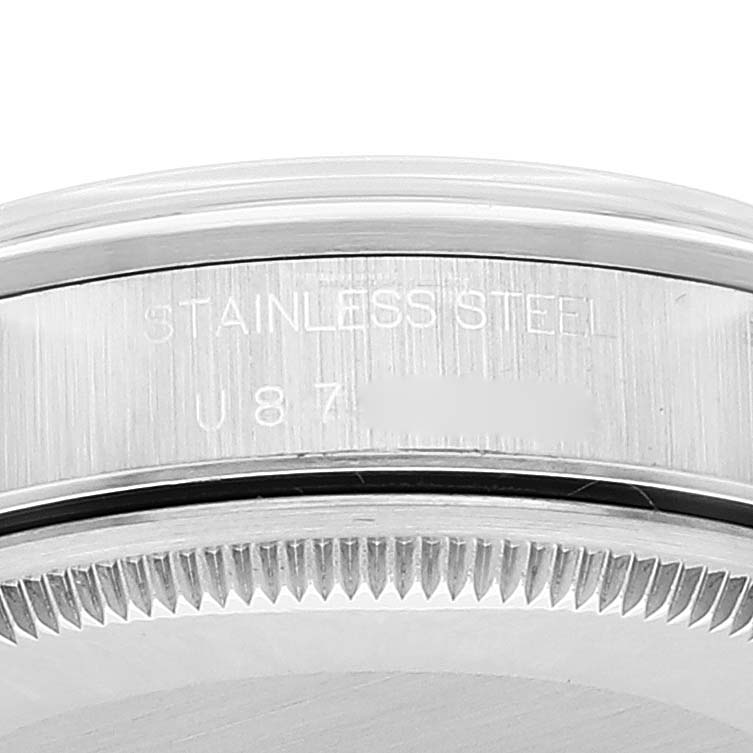 The image shows a close-up of the case back and part of the bezel of a Rolex Air-King 14000 Men's Stainless Steel Blue Dial 14000 Men's Stainless Steel Blue Dial watch, highlighting the stainless steel and serial number engravings.