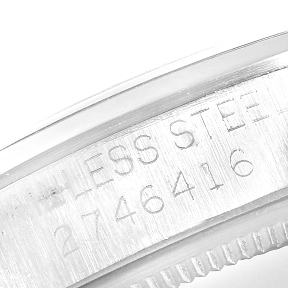 The image shows a close-up of the engraving on the bezel of a Rolex Air-King 5500 Men's Stainless Steel Silver Dial 5500 Men's Stainless Steel Silver Dial watch, showcasing its stainless steel material.
