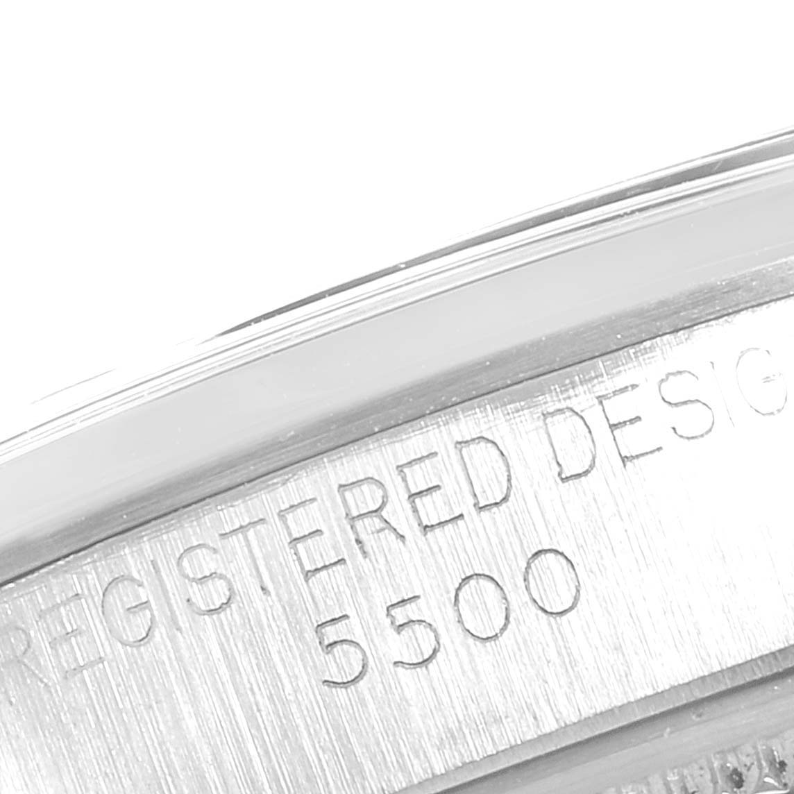 A close-up of the side of the Rolex Air-King 5500 Men's Stainless Steel Silver Dial 5500 Men's Stainless Steel Silver Dial model 5500 case shows engraved text.