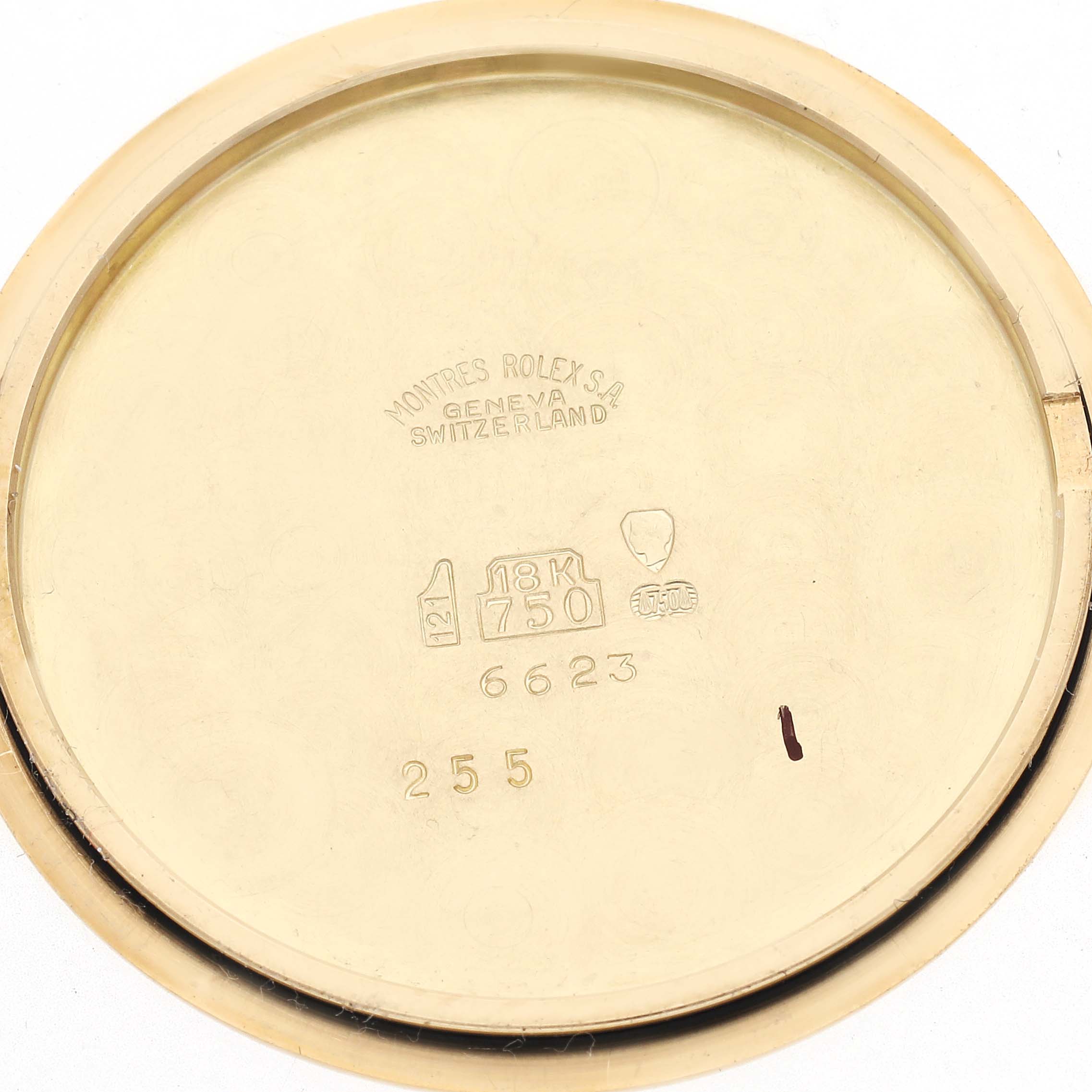 The image shows the inside of a Rolex Cellini 6623 Men's Yellow Gold Champagne Dial 6623 Men's Yellow Gold Champagne Dial watch case back, marked with engravings and gold purity stamps.