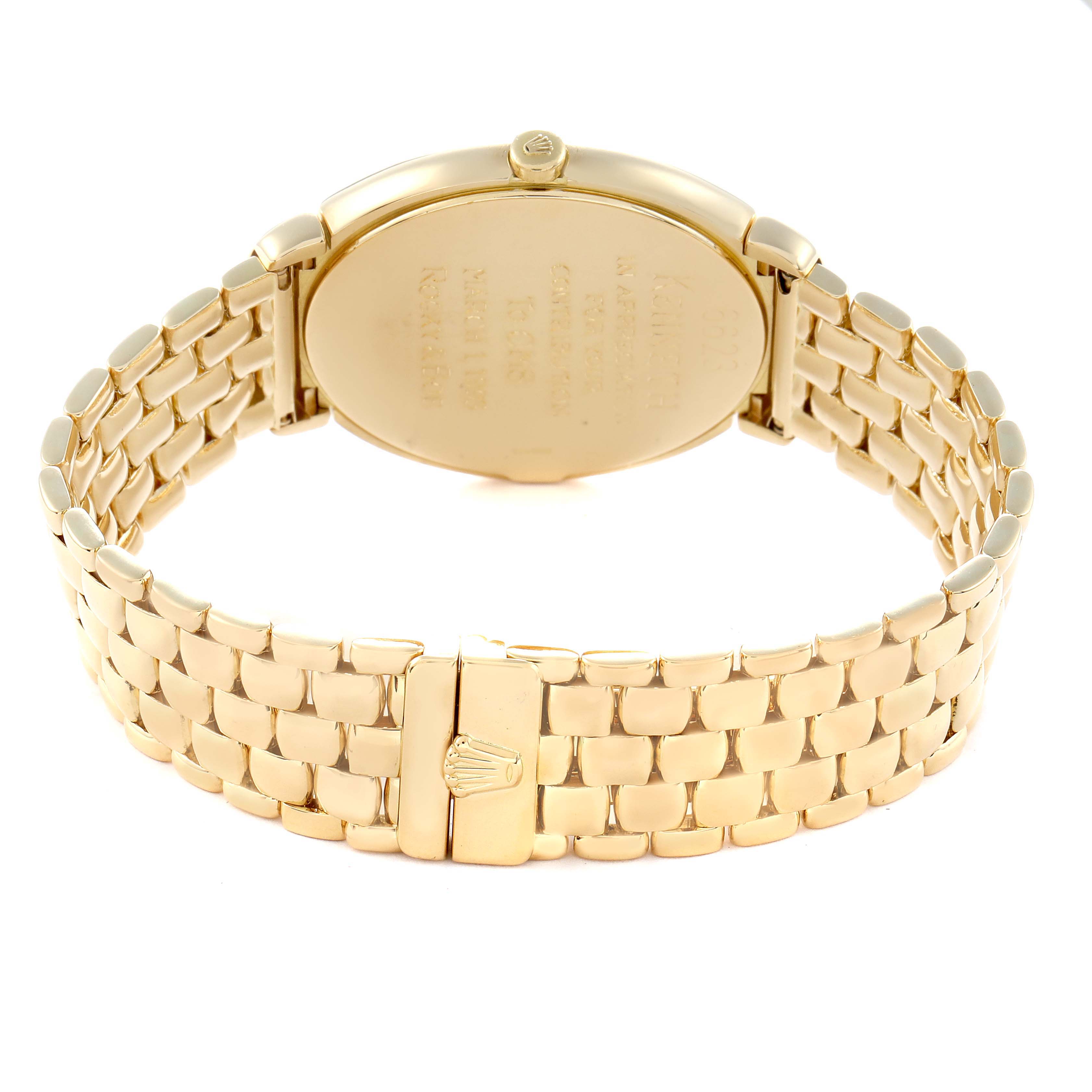 The Rolex Cellini 6623 Men's Yellow Gold Champagne Dial 6623 Men's Yellow Gold Champagne Dial watch is shown from the back, displaying its case back and gold bracelet with a clasp.