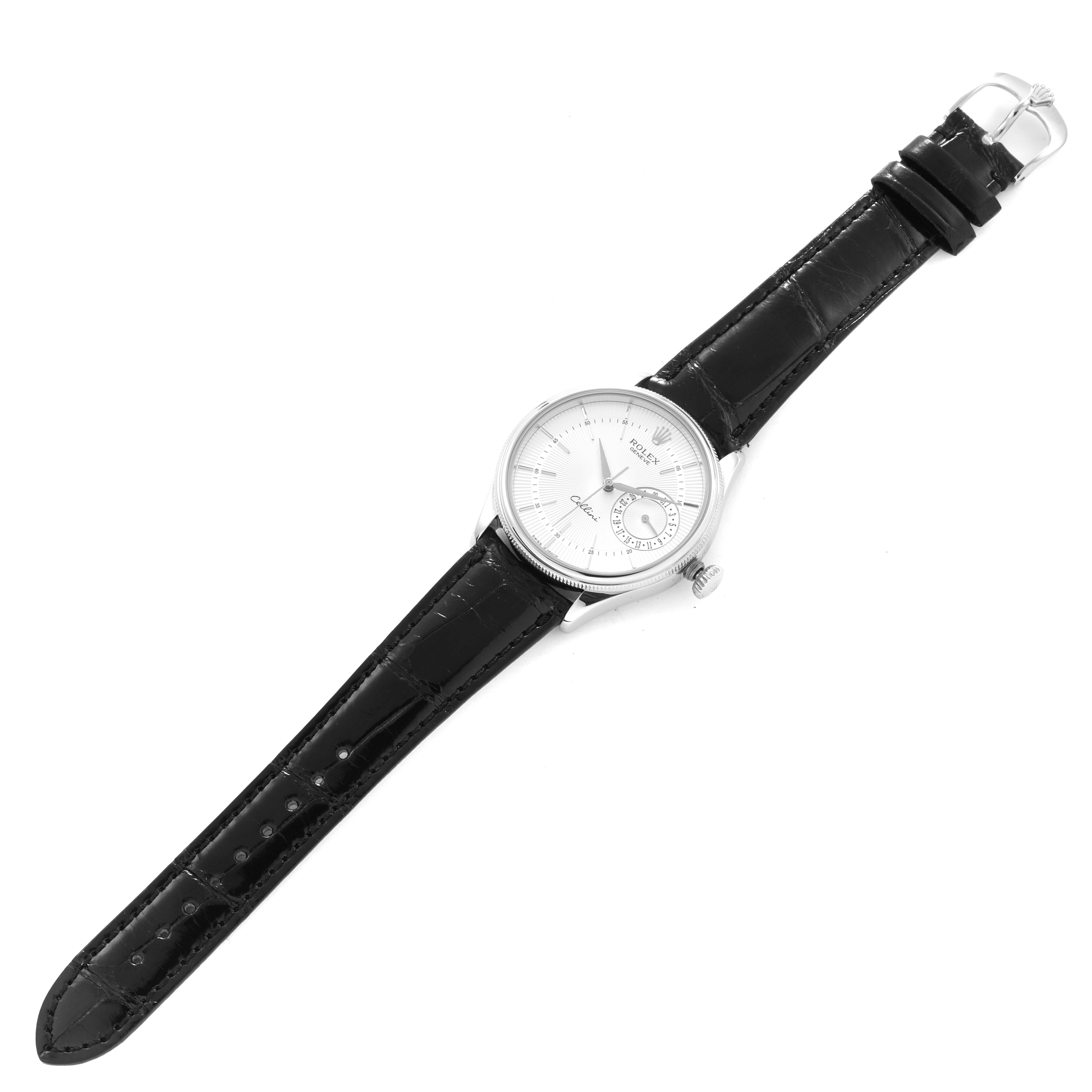 The Rolex Cellini 50519 Men's White Gold Silver Dial 50519 Men's White Gold Silver Dial watch is shown at an angled overhead view, displaying the face, leather strap, and buckle.