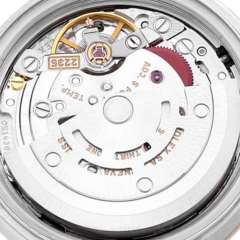 The image shows a close-up view of the Rolex Datejust 79173 Women
s Steel and Gold (two tone) White Dial 79173 Women
s Steel and Gold (two tone) White Dial watch movement from the back, highlighting its intricate components.