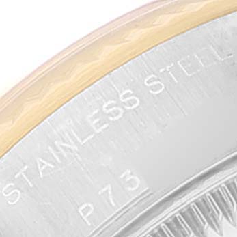 The image shows a close-up of the stainless steel case back edge of a Rolex Datejust 79173 Women
s Steel and Gold (two tone) White Dial 79173 Women
s Steel and Gold (two tone) White Dial watch.