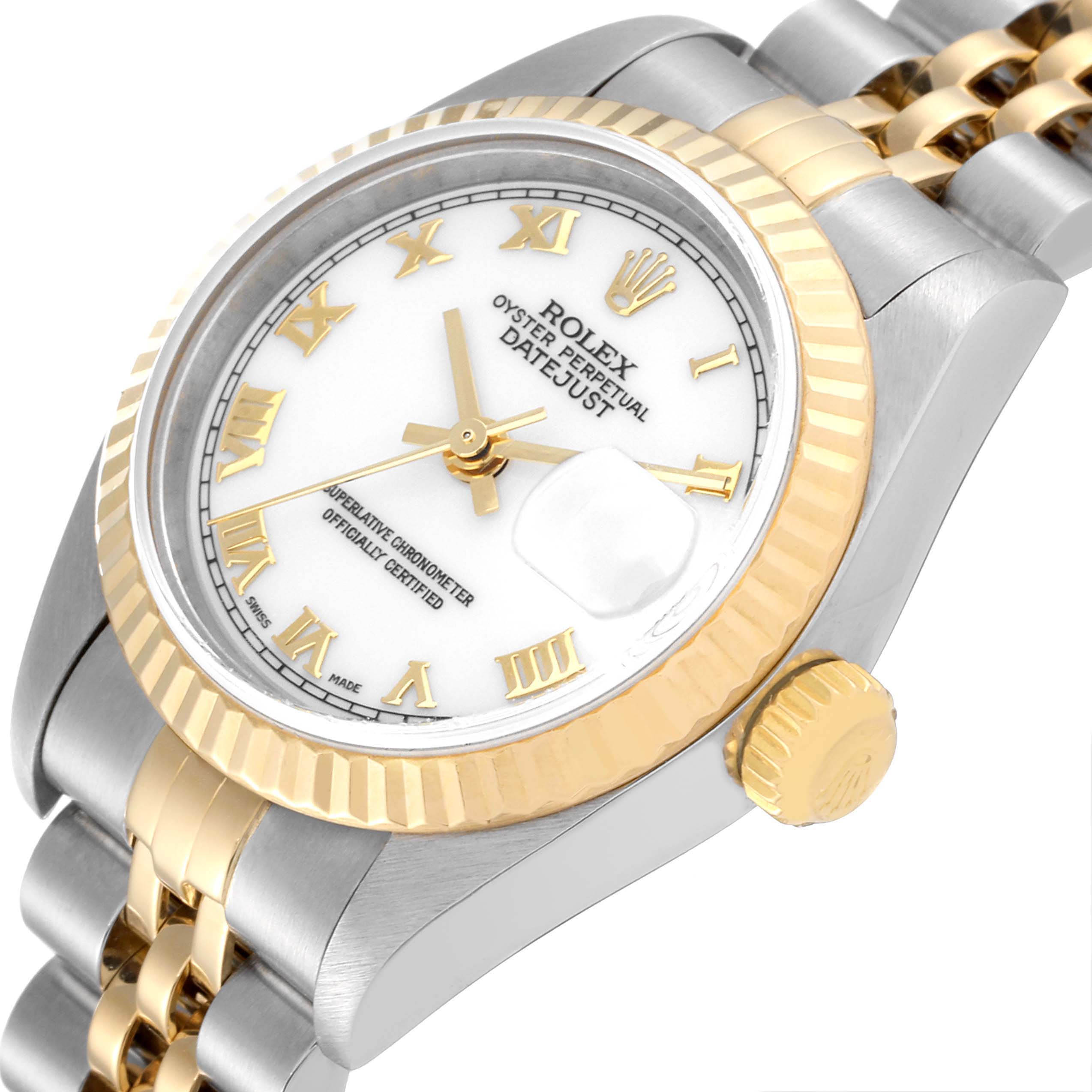 The image shows an angled view of a Rolex Datejust 79173 Women
s Steel and Gold (two tone) White Dial 79173 Women
s Steel and Gold (two tone) White Dial watch, highlighting the dial, fluted bezel, crown, and part of the jubilee bracelet.