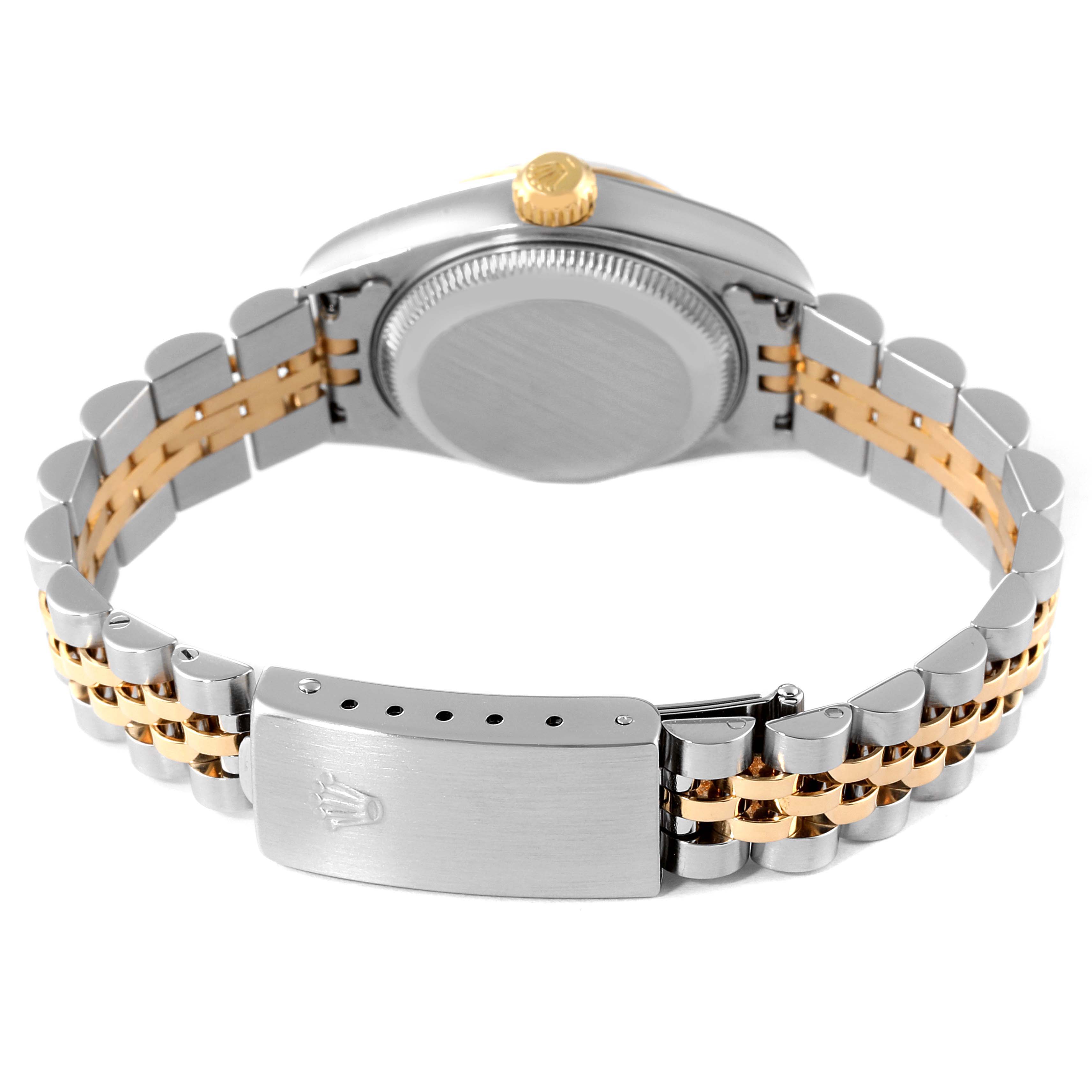 This image shows the back view of a Rolex Datejust 79173 Women
s Steel and Gold (two tone) White Dial 79173 Women
s Steel and Gold (two tone) White Dial watch, highlighting its clasp, bracelet, case back, and crown.