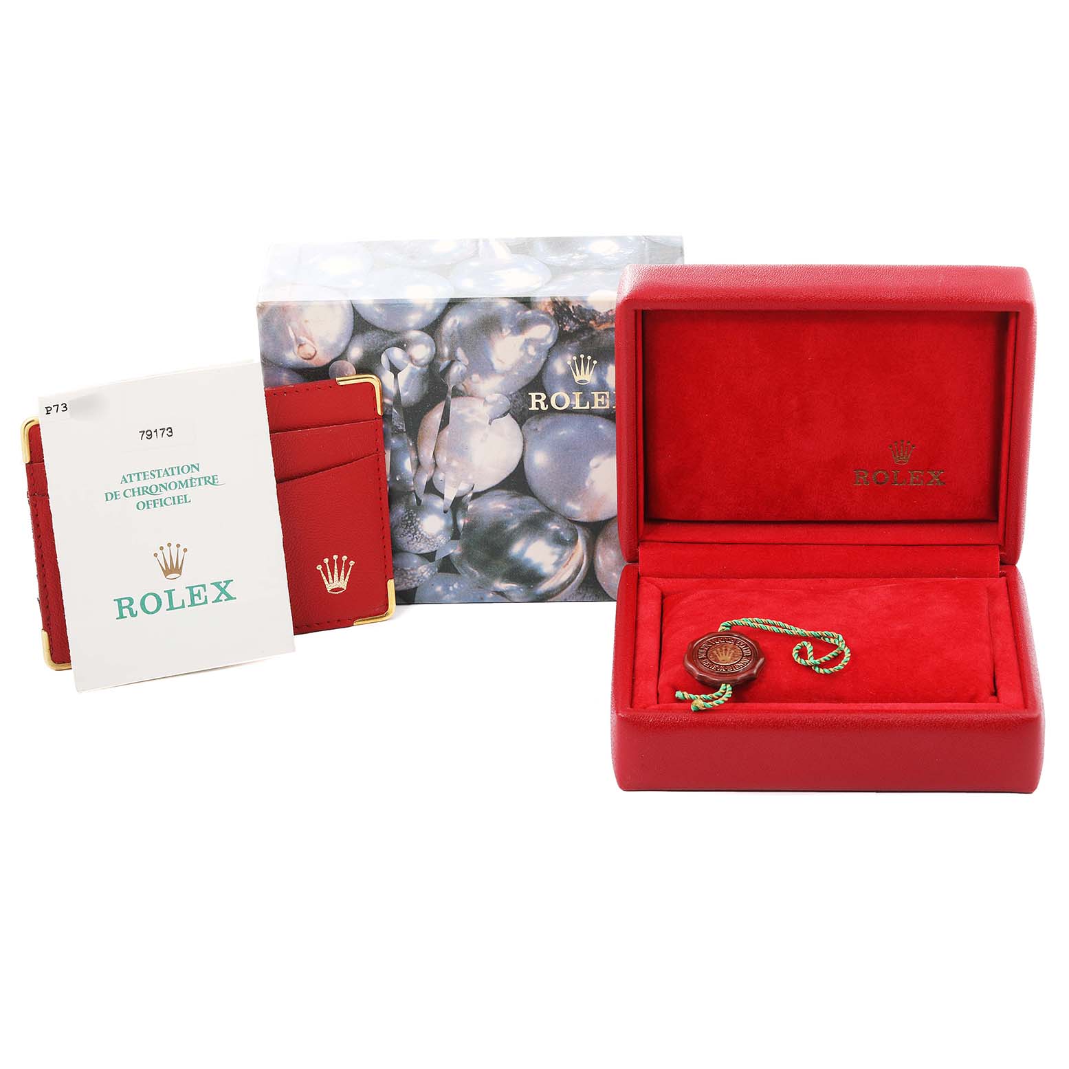 The image shows the packaging for a Rolex Datejust 79173 Women
s Steel and Gold (two tone) White Dial 79173 Women
s Steel and Gold (two tone) White Dial, including the box, booklet, certificate, and tag.