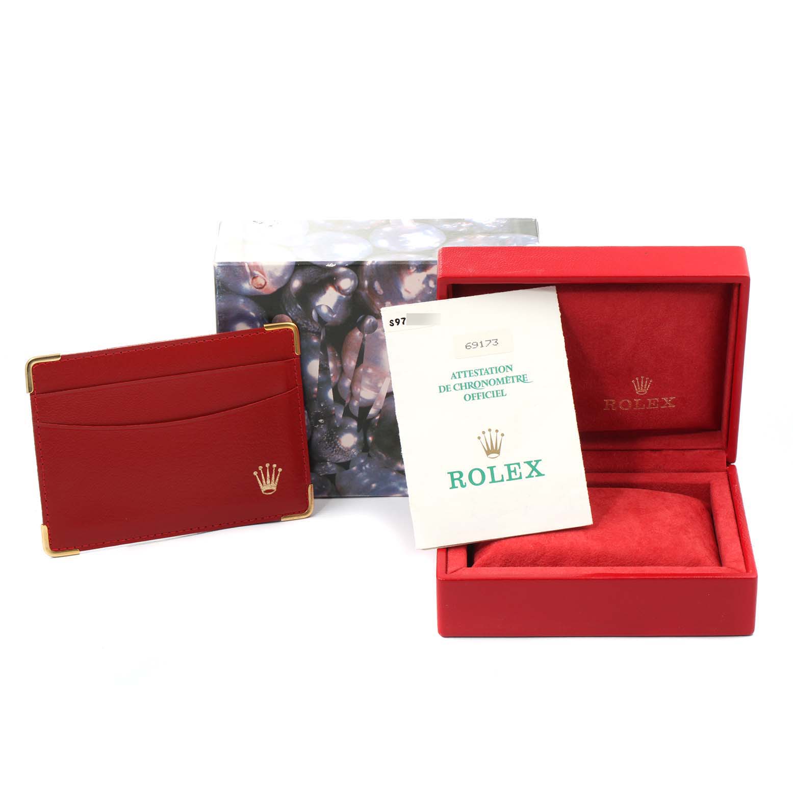 This image shows a box, booklet, and cardholder for the Rolex Datejust 69173 Women's Stainless Steel Champagne Dial 69173 Women's Stainless Steel Champagne Dial watch, with the box open to reveal the watch cushion.
