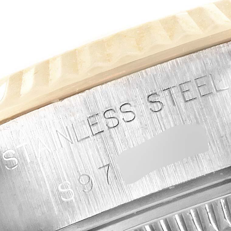 This close-up image shows the edge of the casing and part of the bezel of a Rolex Datejust 69173 Women's Stainless Steel Champagne Dial 69173 Women's Stainless Steel Champagne Dial model.
