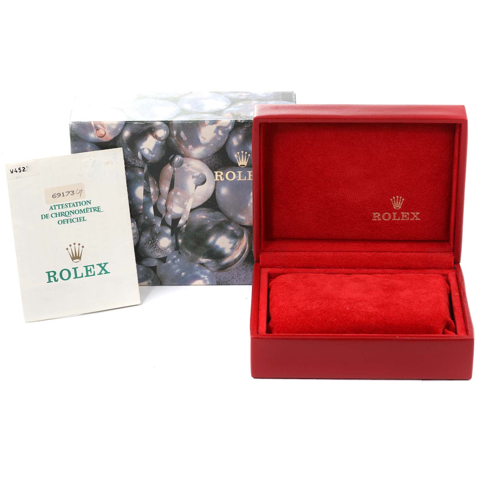 The image shows the packaging, manual, and a red interior box for the Rolex Datejust 69173 Women
s Steel and Gold (two tone) Champagne Dial 69173 Women
s Steel and Gold (two tone) Champagne Dial model watch.