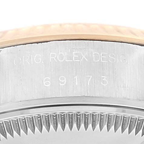 This image shows a close-up of the serial number and bezel of a Rolex Datejust 69173 Women
s Steel and Gold (two tone) Champagne Dial 69173 Women
s Steel and Gold (two tone) Champagne Dial watch.