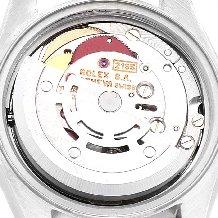 This close-up image shows the movement and internal components of the Rolex Datejust 69173 Women
s Steel and Gold (two tone) Champagne Dial 69173 Women
s Steel and Gold (two tone) Champagne Dial watch from the back.