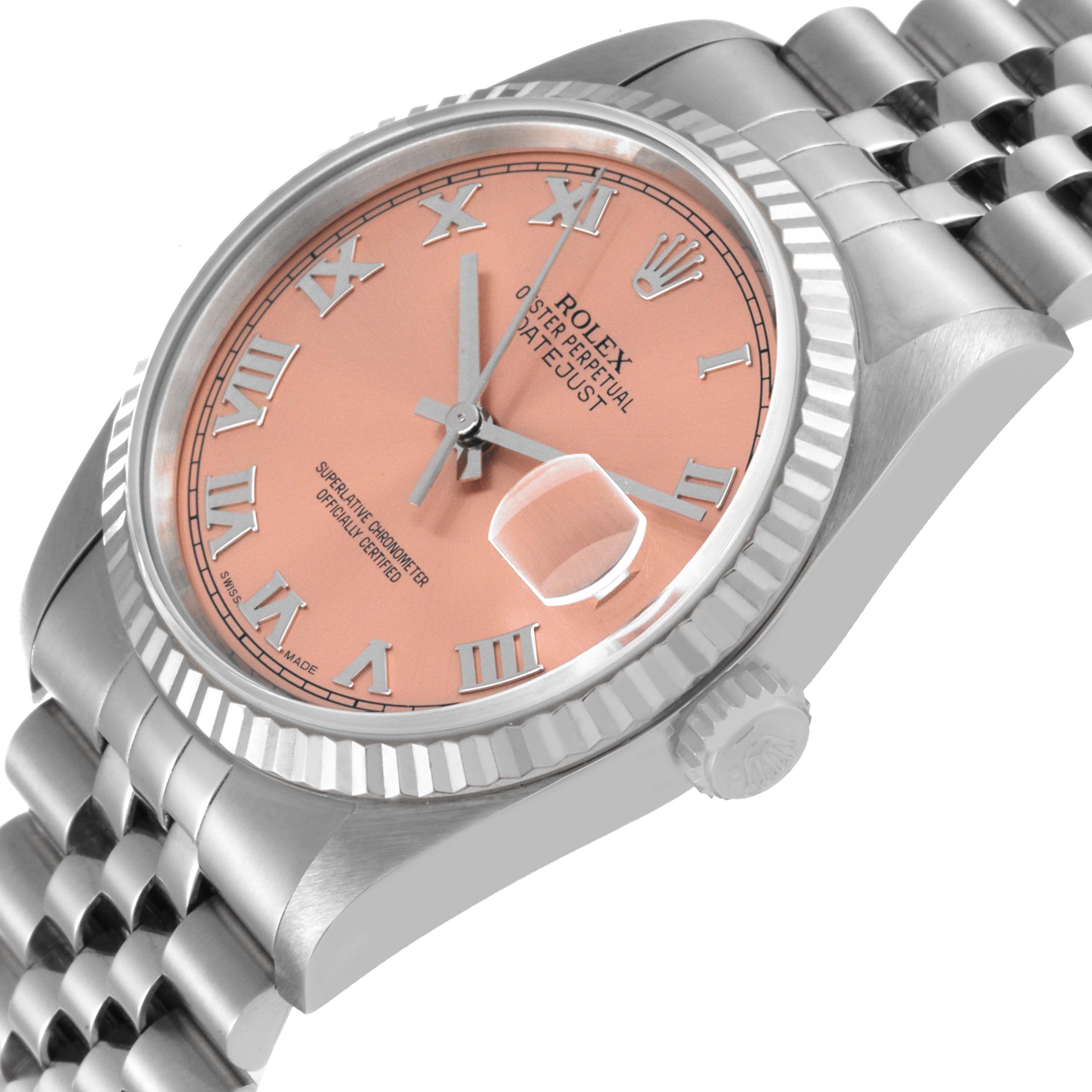The image shows a side angle of a Rolex Datejust 16234 Men's Stainless Steel Pink Dial 16234 Men's Stainless Steel Pink Dial watch, highlighting the pink dial, Roman numerals, and jubilee bracelet.