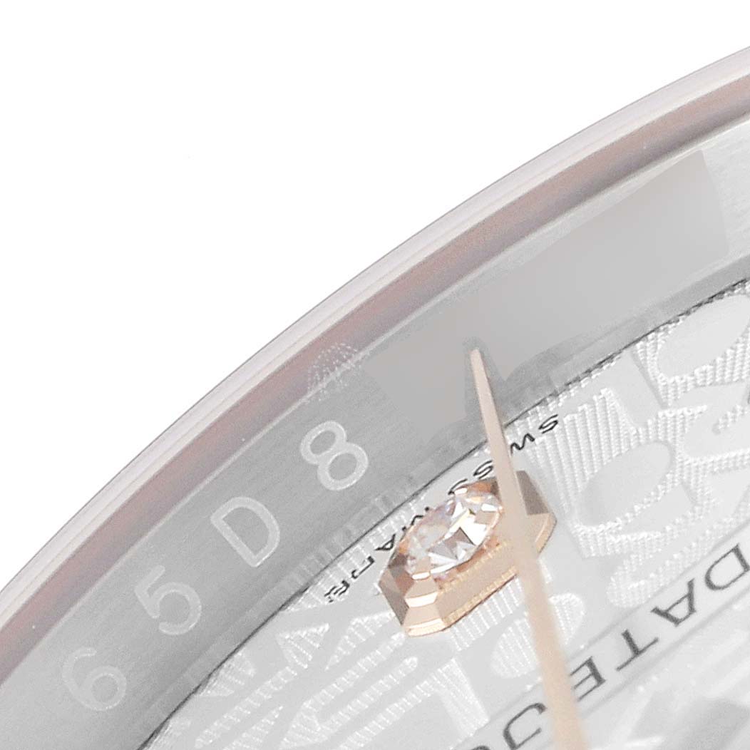 The image shows a close-up angle of the dial and bezel of the Rolex Datejust 116231 Men's Steel and Gold (two tone) Silver Dial 116231 Men's Steel and Gold (two tone) Silver Dial watch, highlighting the serial number engraving and indices.