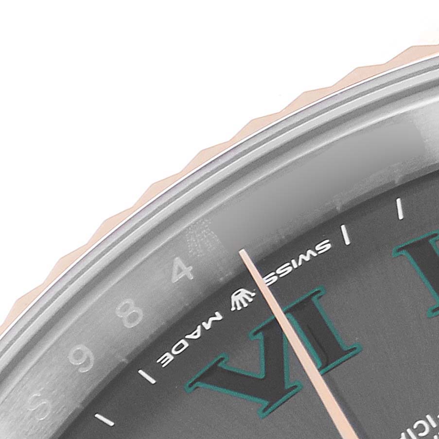 The image shows a close-up of the dial and bezel of a Rolex Datejust 41 126331 Men's Steel and Gold (two tone) Grey Dial 126331 Men's Steel and Gold (two tone) Grey Dial watch, focusing on the hour markers and the "Swiss Made" text.