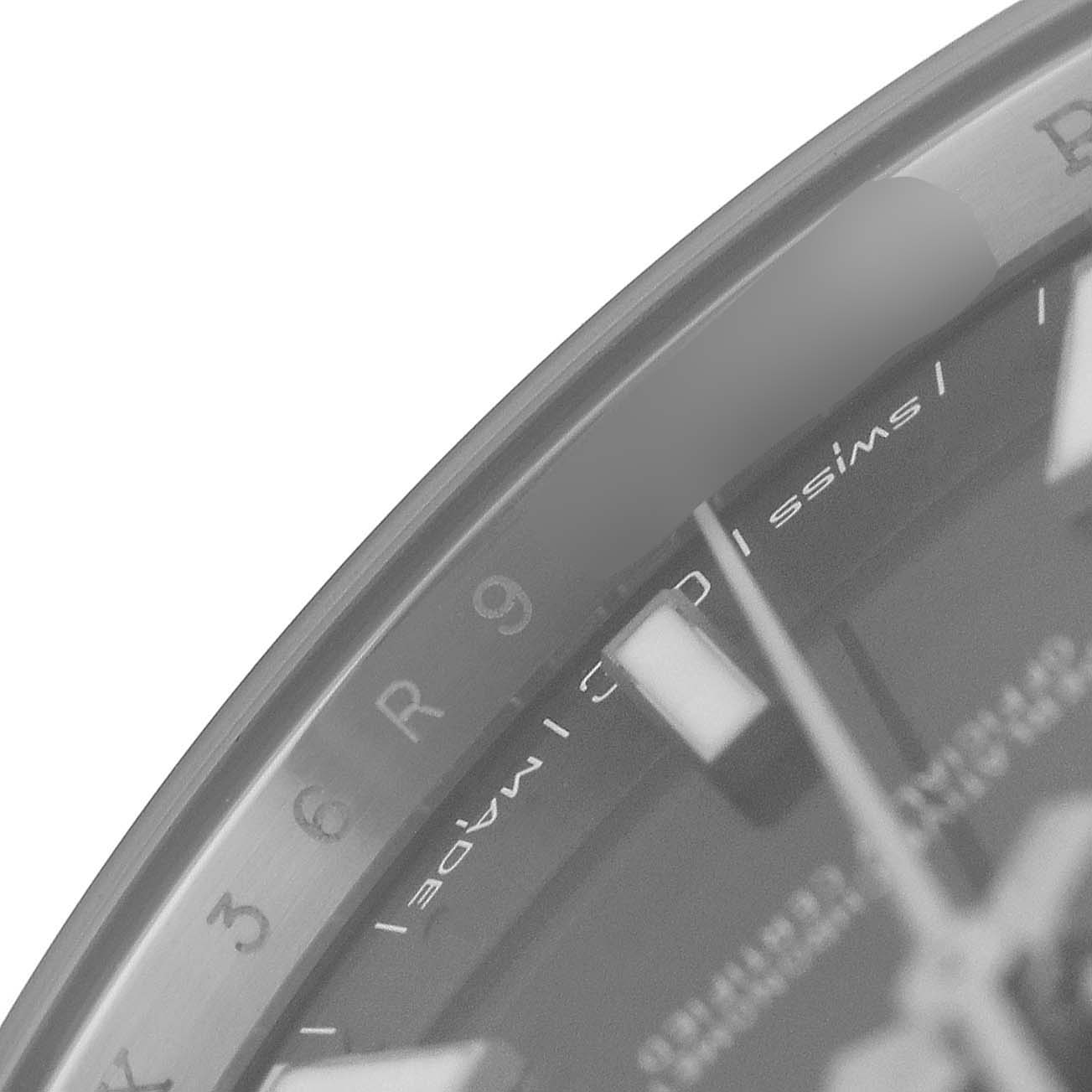 The image shows a close-up of the bezel and dial of the Rolex Datejust 41 126300 Men's Stainless Steel Grey Dial, focusing on the hour markers and part of the text.
