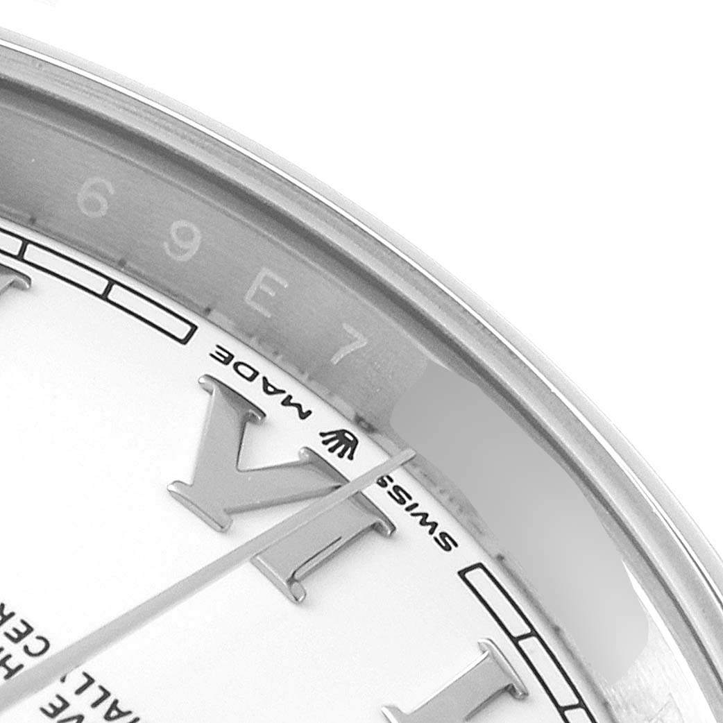 The image shows a close-up of the dial and flange of a Rolex Datejust 41 126300 Men
s Stainless Steel White Dial 126300 Men
s Stainless Steel White Dial, highlighting the Roman numeral hour markers and part of the text.