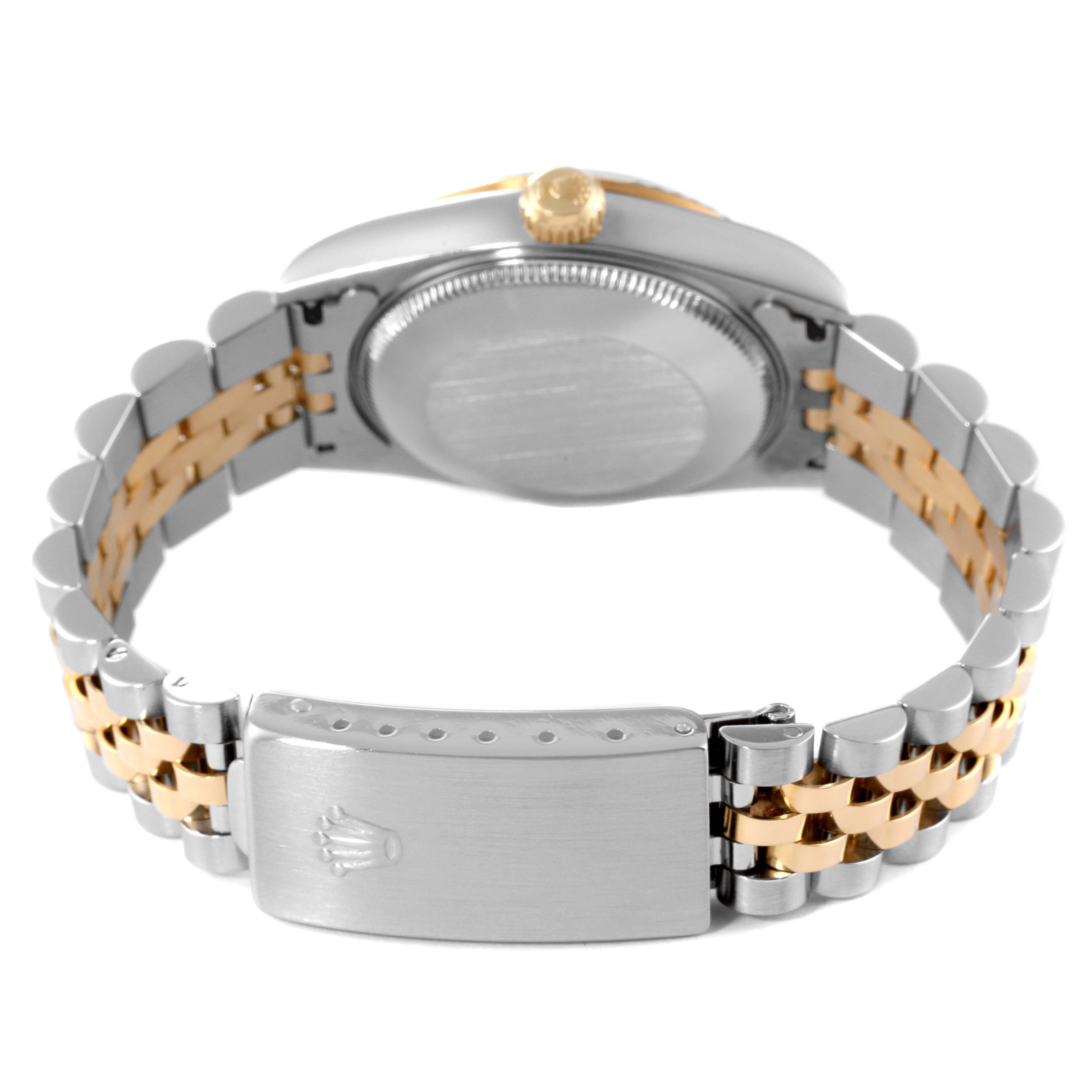 The photo shows the back case and clasp of a Rolex Mid-Size 68273 Women
s Steel and Gold (two tone) Blue Dial 68273 Women
s Steel and Gold (two tone) Blue Dial watch, highlighting the two-tone bracelet.