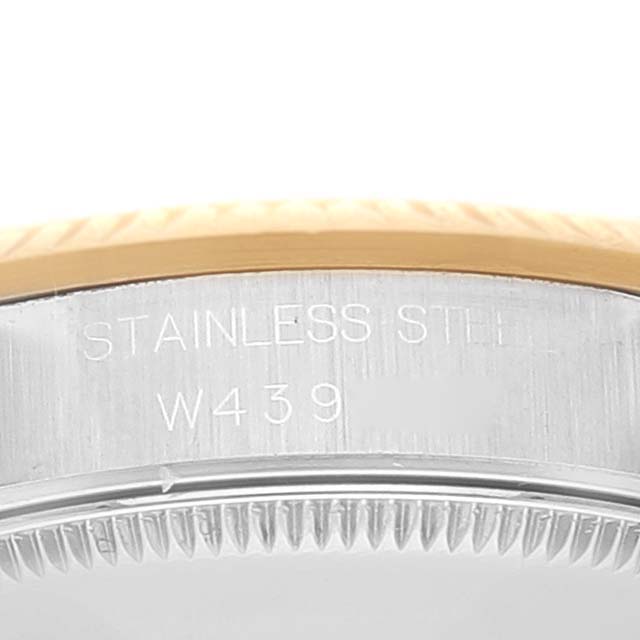 Close-up of a Rolex Mid-Size 68273 Women
s Steel and Gold (two tone) Champagne Dial 68273 Women
s Steel and Gold (two tone) Champagne Dial watch case engraving showing "STAINLESS STEEL" and "W439."