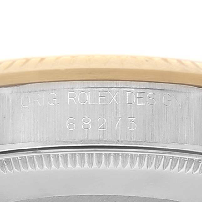 This image shows the side view of the case of a Mid-Size Rolex watch, displaying the model number 
68273
 and the engraving "Orig. Rolex Design".