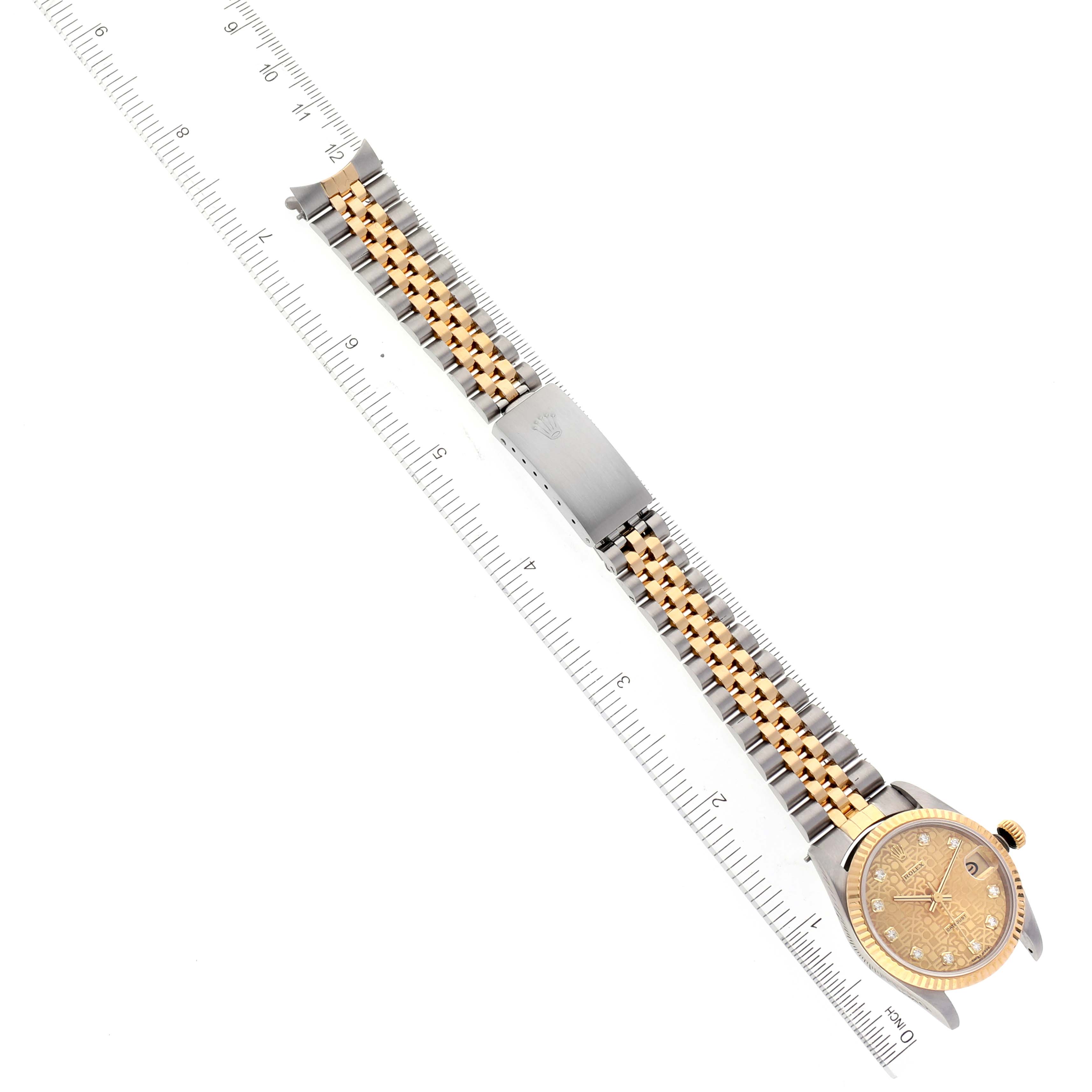 The image shows a Rolex Mid-Size 68273 Women
s Steel and Gold (two tone) Champagne Dial 68273 Women
s Steel and Gold (two tone) Champagne Dial watch laid flat with its face, crown, bracelet, and clasp visible, including rulers for scale.