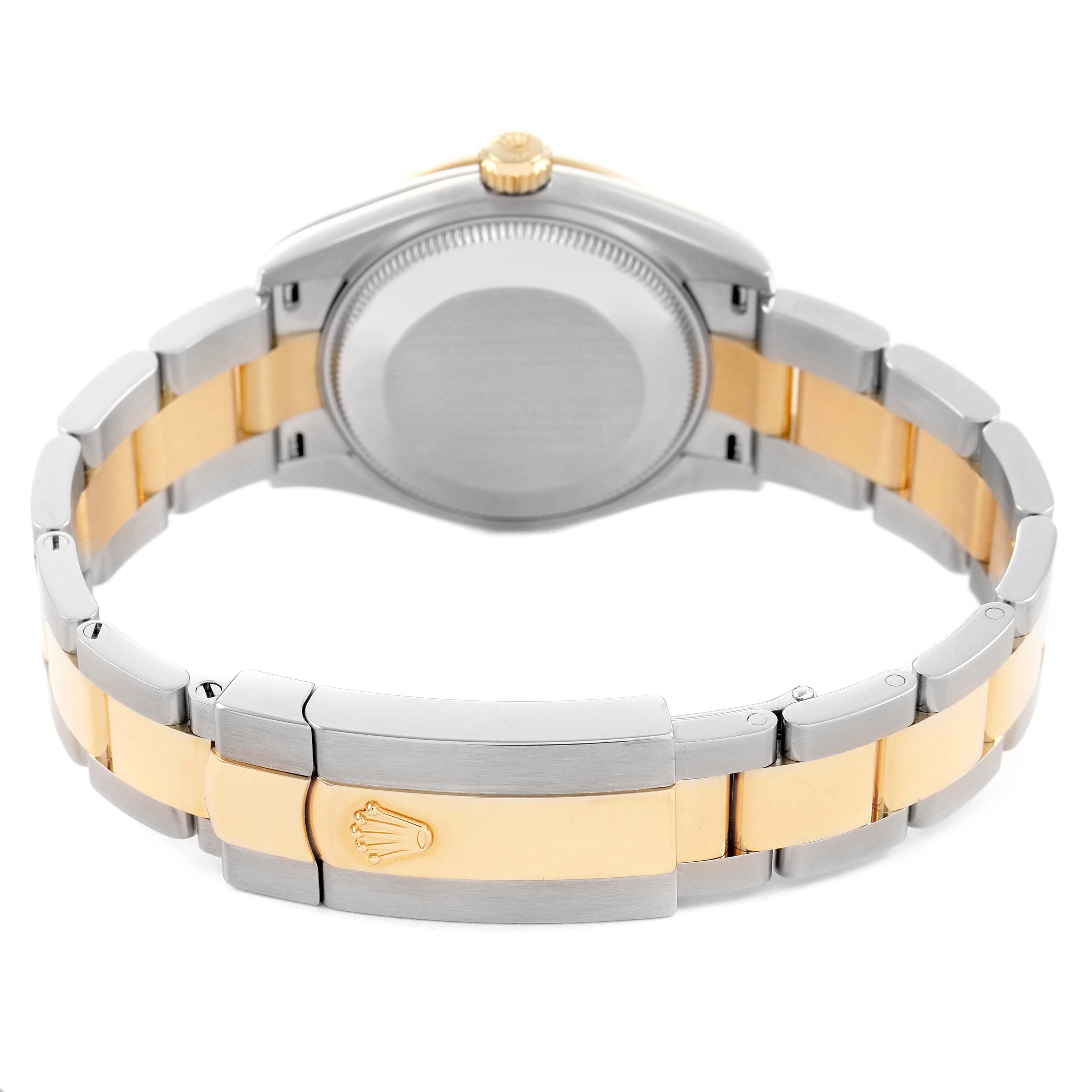 The watch is a mid-size Rolex, showing the back case, bracelet, and clasp from a rear angle.