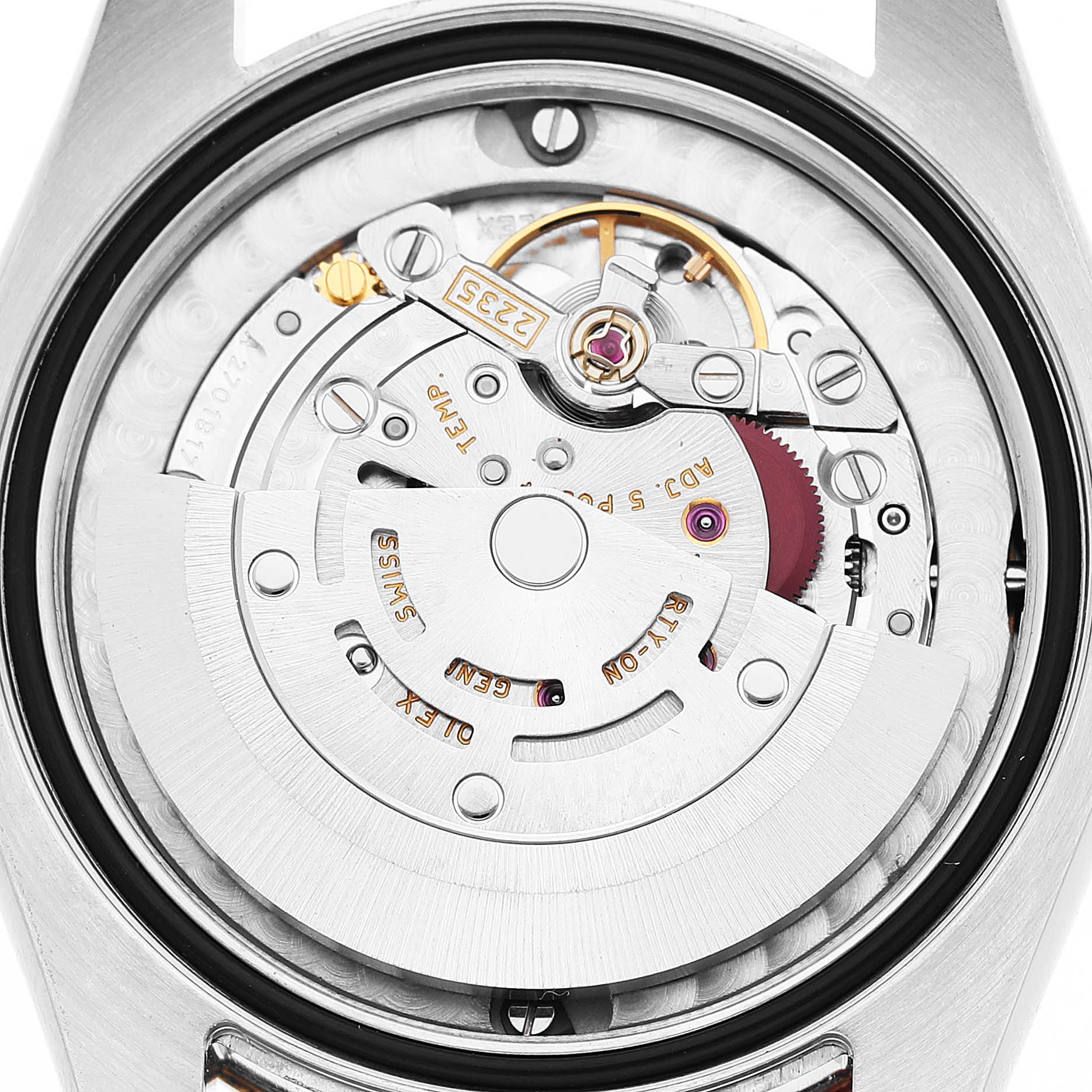 The image shows the movement and inner mechanism of a Rolex Datejust 178273 Women's Steel and Gold (two tone) Champagne Dial watch from a rear angle, focusing on the rotor and gears.