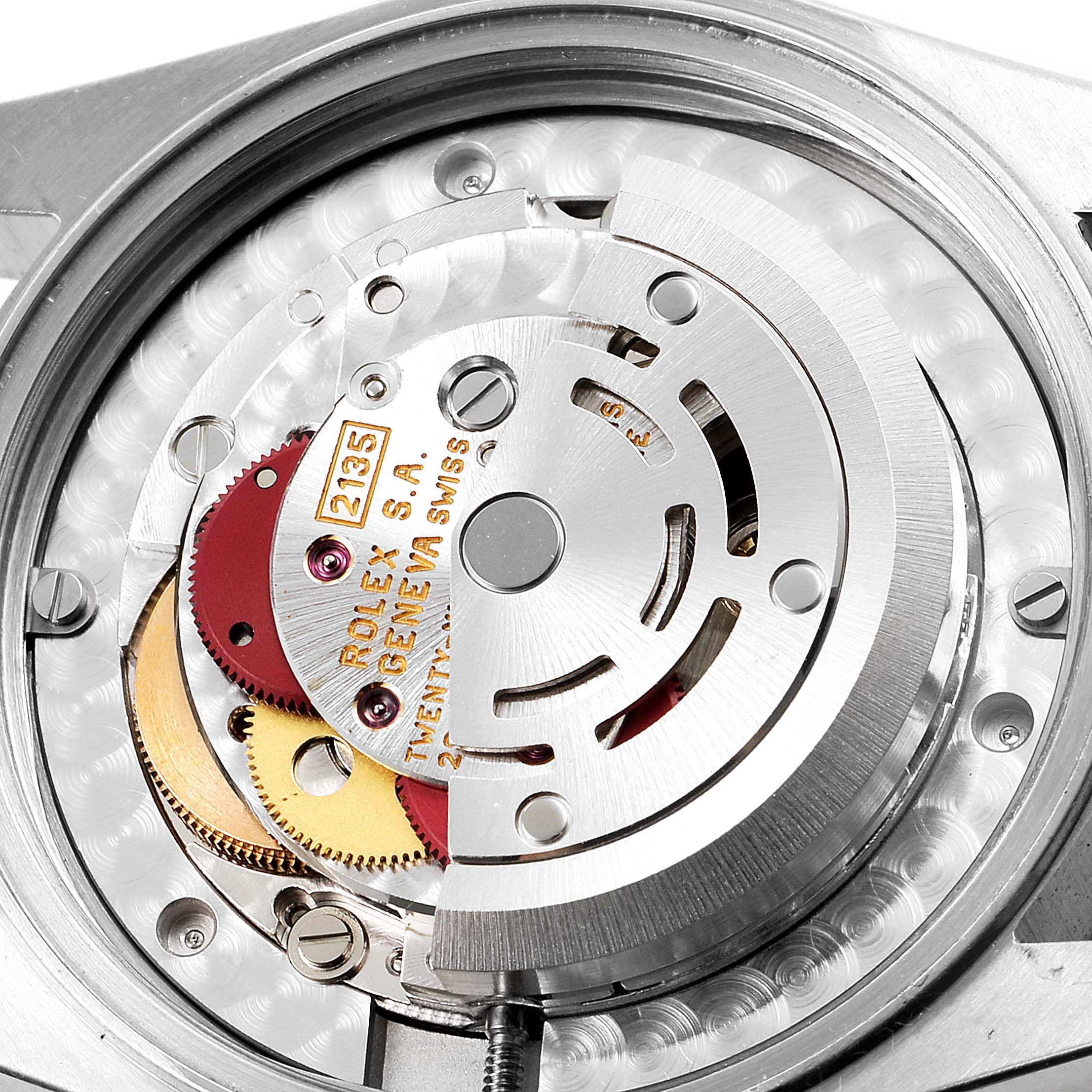This image shows a close-up view of the internal mechanism of a mid-size Rolex watch, including gears and the rotor.