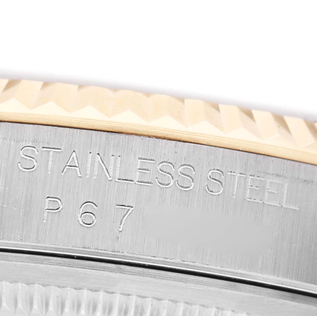 The image shows the side view of a Rolex Datejust 16233 Men's Steel and Gold (two tone) Blue Dial watch, highlighting the stainless steel marking on the case.