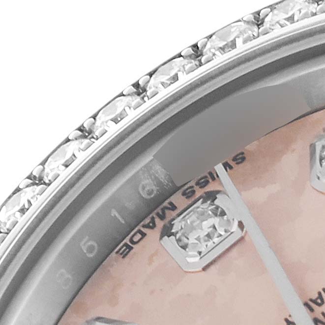 This is a close-up, angled image of the bezel and dial, showing diamond hour markers on a Rolex Datejust 179384 Women's Stainless Steel Pink Dial 179384 Women's Stainless Steel Pink Dial watch.