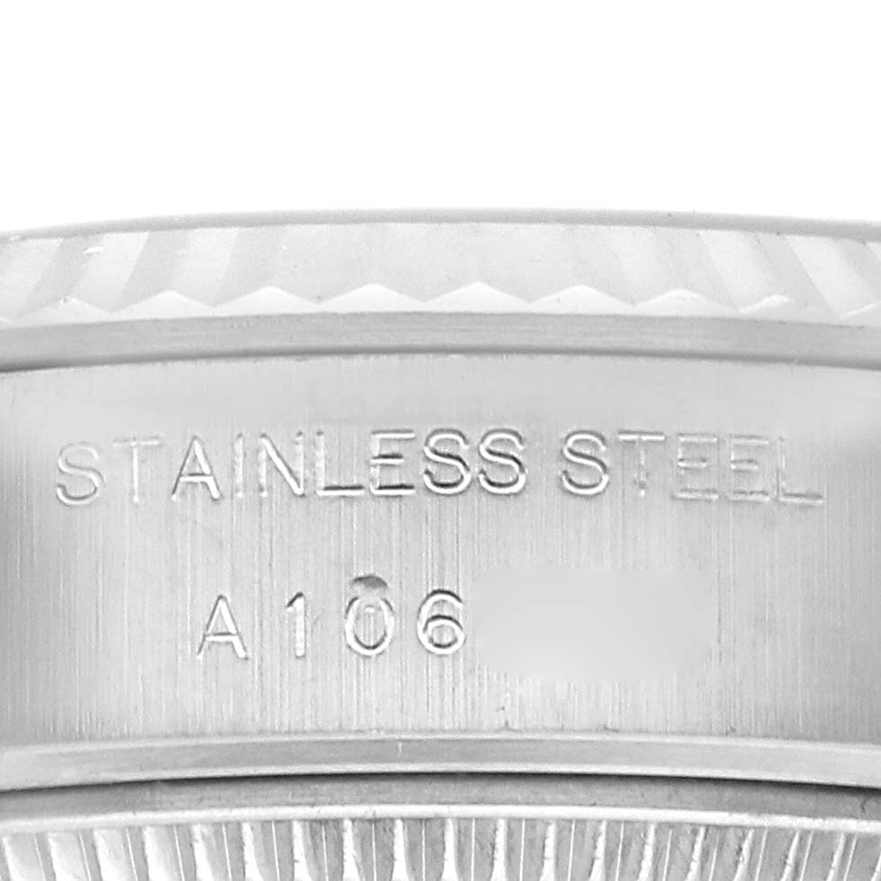 The image shows a close-up of the side of a Rolex Datejust 71614 Women
s Stainless Steel Mother of Pearl Dial 71614 Women
s Stainless Steel Mother of Pearl Dial watch, highlighting the stainless steel material and engraving.