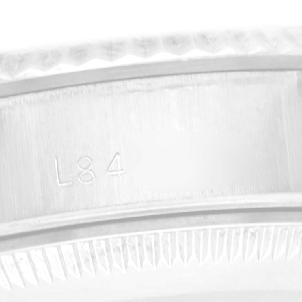 The image shows a close-up of the inner bezel with fluted detailing on a Rolex Datejust 69174 Women
s Stainless Steel Silver Dial 69174 Women
s Stainless Steel Silver Dial watch.
