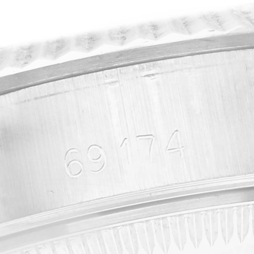The image shows a close-up of the reference number engraved on the case of a Rolex Datejust 69174 Women
s Stainless Steel Silver Dial 69174 Women
s Stainless Steel Silver Dial watch.