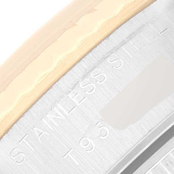 This is a close-up image showing part of the case and the bezel of a Rolex Datejust 69173 Women's Steel and Gold (two tone) Beige Dial 69173 Women's Steel and Gold (two tone) Beige Dial watch, with "Stainless Steel" engraving visible.