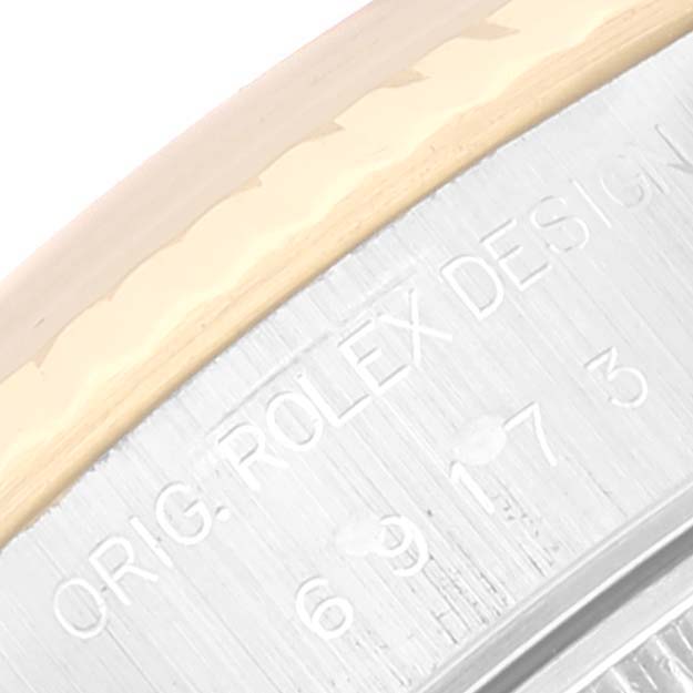 This close-up angle shows the engraved writing on the side of the case of the Rolex Datejust 69173 Women's Steel and Gold (two tone) Beige Dial 69173 Women's Steel and Gold (two tone) Beige Dial watch.