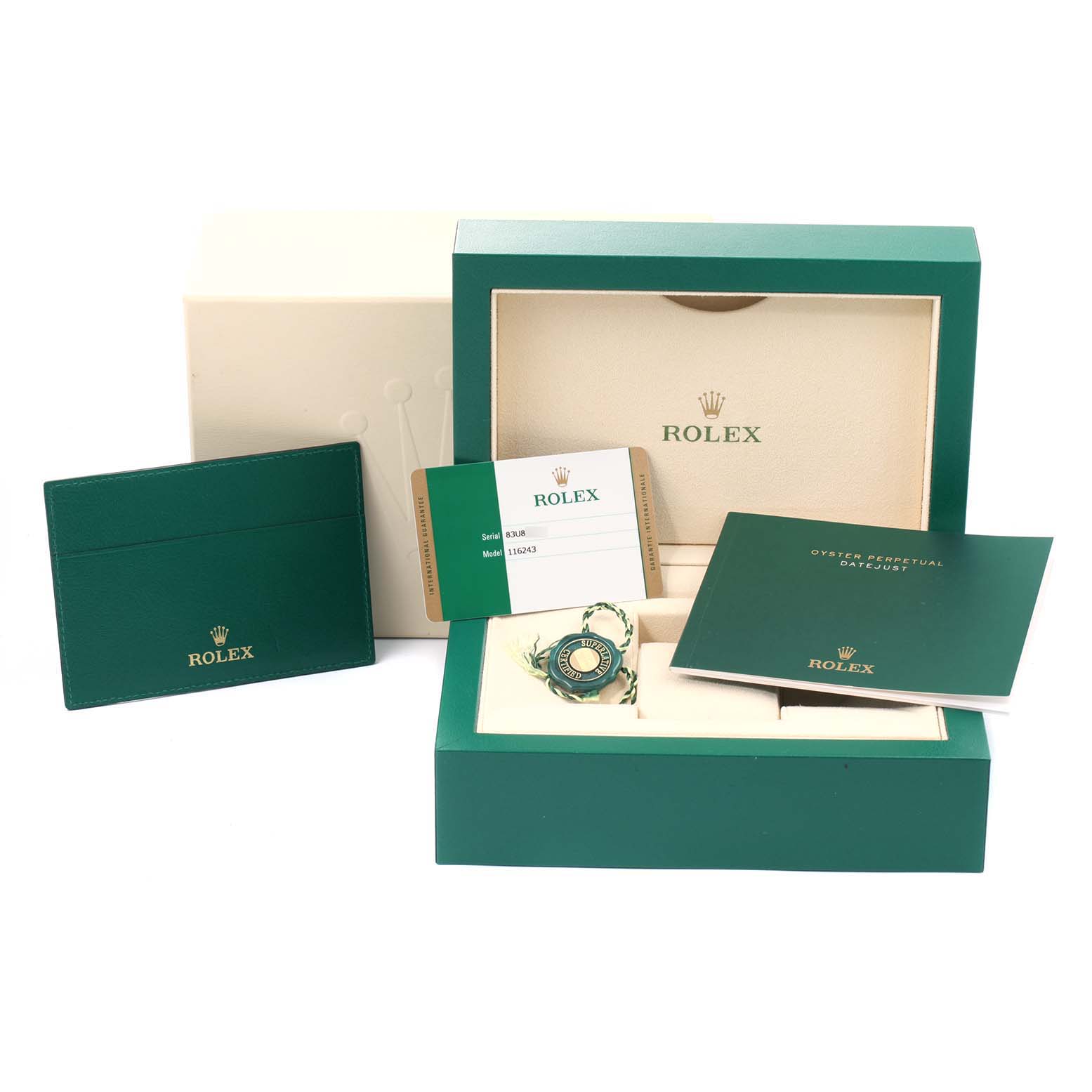 The image shows the packaging and accessories of a Rolex Datejust 116243 Men's Steel and Gold (two tone) Champagne Dial 116243 Men's Steel and Gold (two tone) Champagne Dial, including the box, warranty card, manual, and tags.