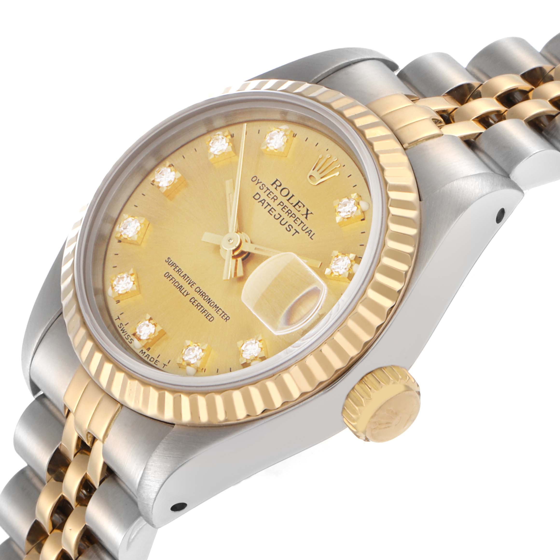 The Rolex Datejust 79173 Women
s Steel and Gold (two tone) Champagne Dial 79173 Women
s Steel and Gold (two tone) Champagne Dial watch is shown at an angled view, highlighting its gold fluted bezel, crown, and Jubilee bracelet.