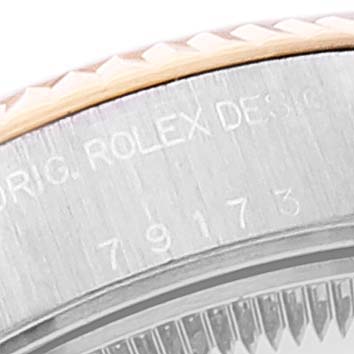The image shows a close-up view of the edge of the bezel and case of a Rolex Datejust 79173 Women's Steel and Gold (two tone) Mother of Pearl Dial 79173 Women's Steel and Gold (two tone) Mother of Pearl Dial watch, featuring the model number engraved.