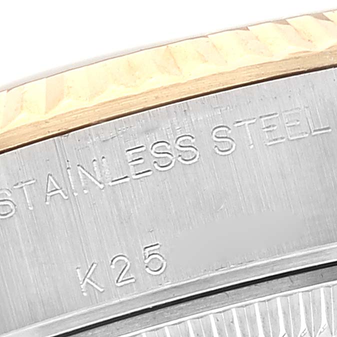 This close-up image shows the edge and engravings on the stainless steel bezel of a Rolex Datejust 79173 Women's Steel and Gold (two tone) Blue Dial 79173 Women's Steel and Gold (two tone) Blue Dial watch.