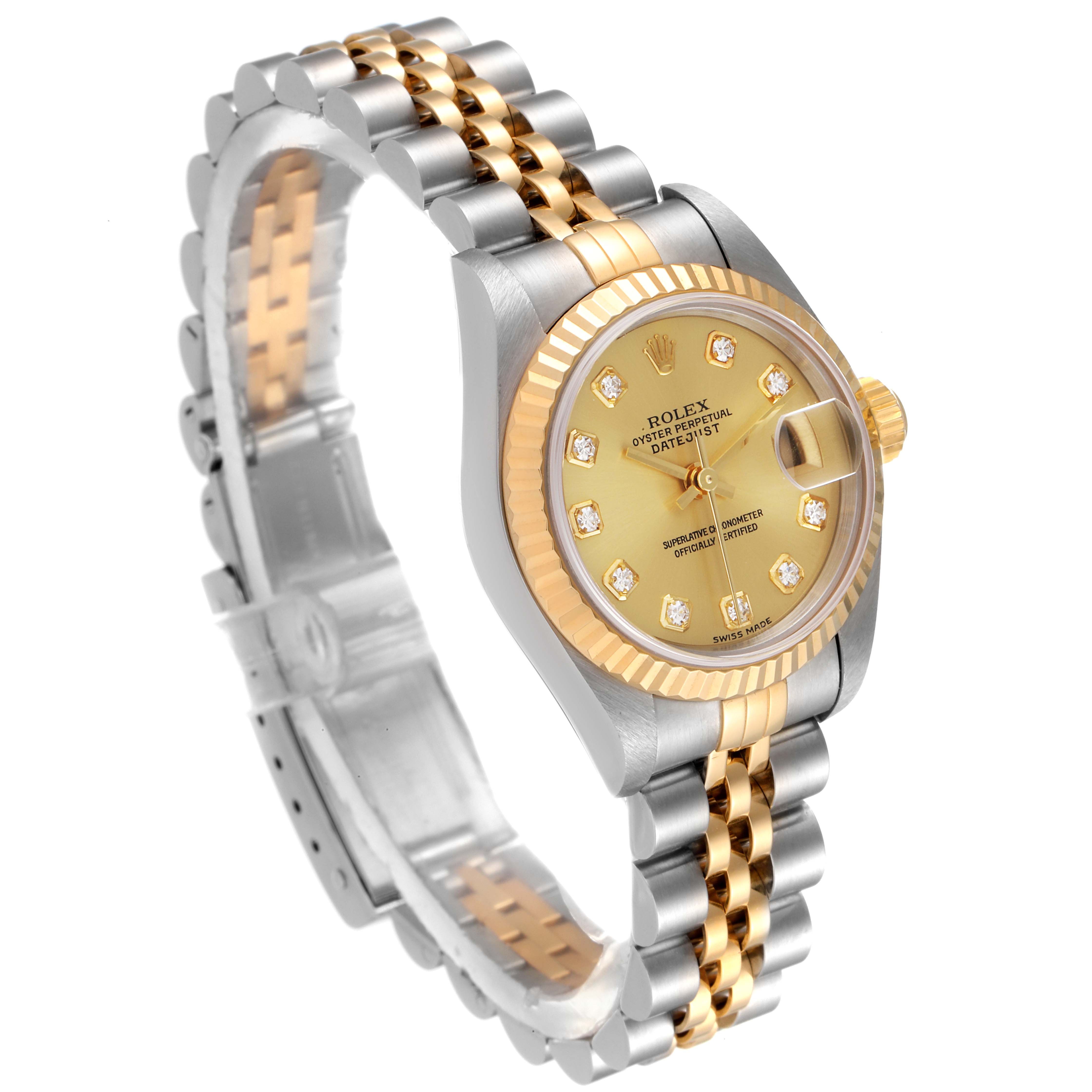 The image shows a Rolex Datejust 79173 Women
s Steel and Gold (two tone) Champagne Dial 79173 Women
s Steel and Gold (two tone) Champagne Dial watch at a three-quarter angle, featuring its dial, bezel, and two-tone bracelet.