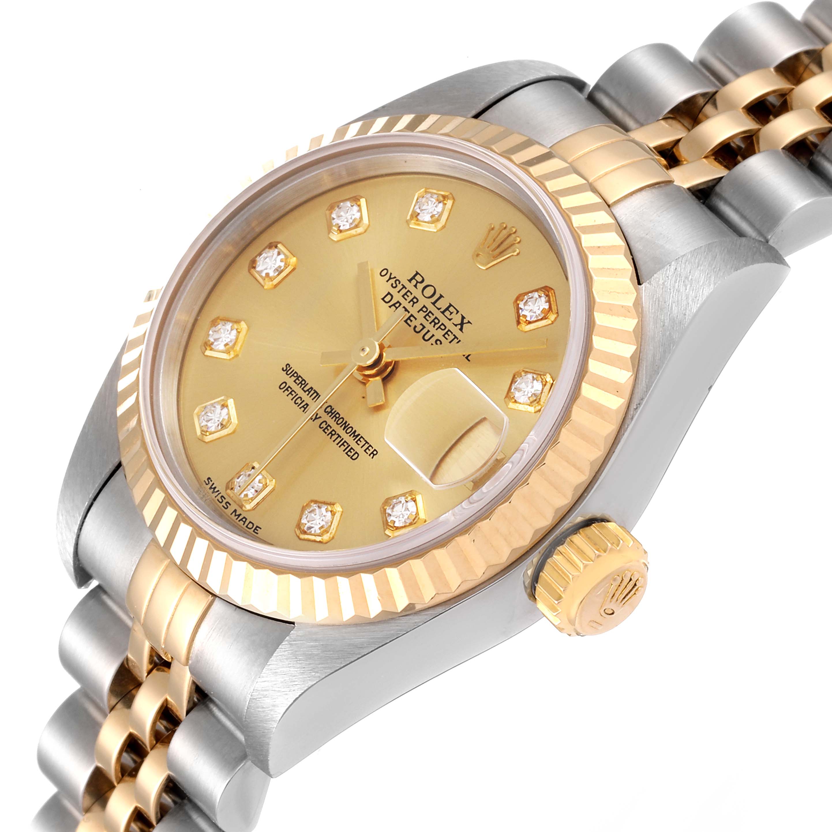 This image shows a close-up angle of a Rolex Datejust 79173 Women
s Steel and Gold (two tone) Champagne Dial 79173 Women
s Steel and Gold (two tone) Champagne Dial watch, highlighting the gold bezel, crown, and two-tone bracelet.