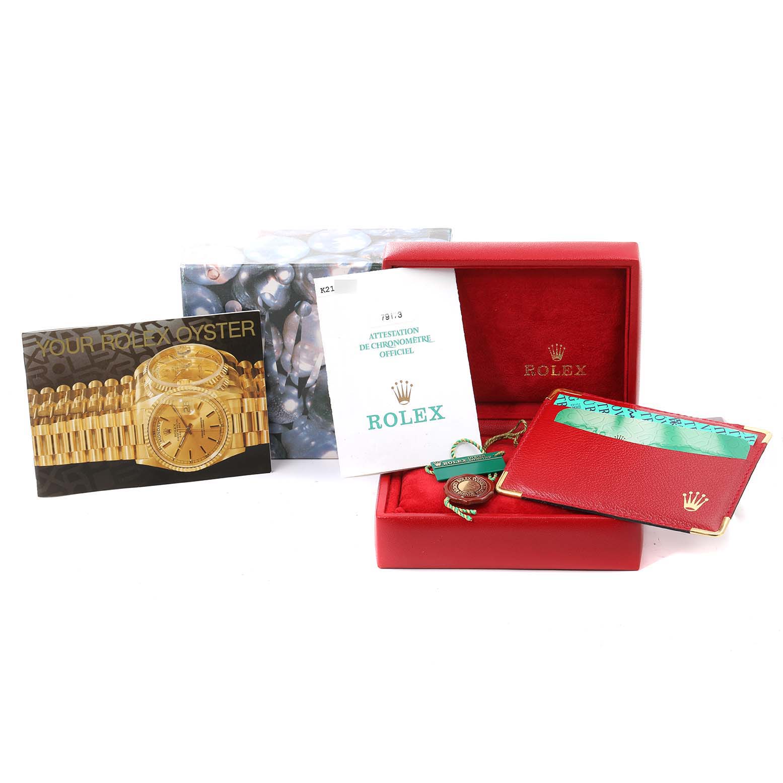 The image shows the packaging, documentation, and accessories for a Rolex Datejust 79173 Women
s Steel and Gold (two tone) Champagne Dial 79173 Women
s Steel and Gold (two tone) Champagne Dial watch, but not the watch itself.