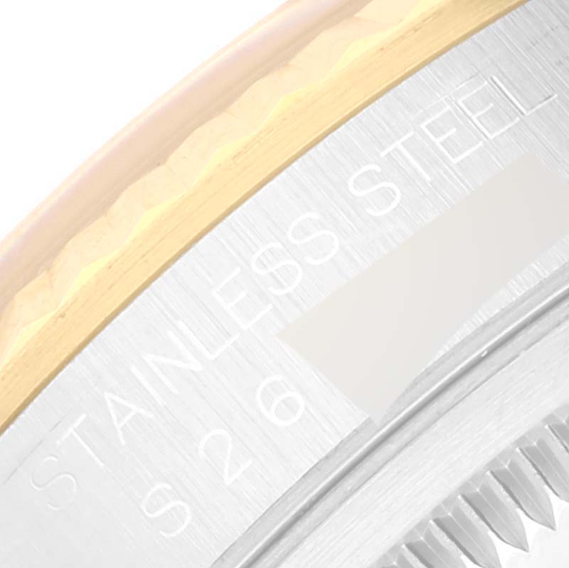 The image shows a partial close-up of the bezel and case side of a Rolex Datejust 16233 Men's Steel and Gold (two tone) Champagne Dial 16233 Men's Steel and Gold (two tone) Champagne Dial watch, highlighting the stainless steel and gold details.