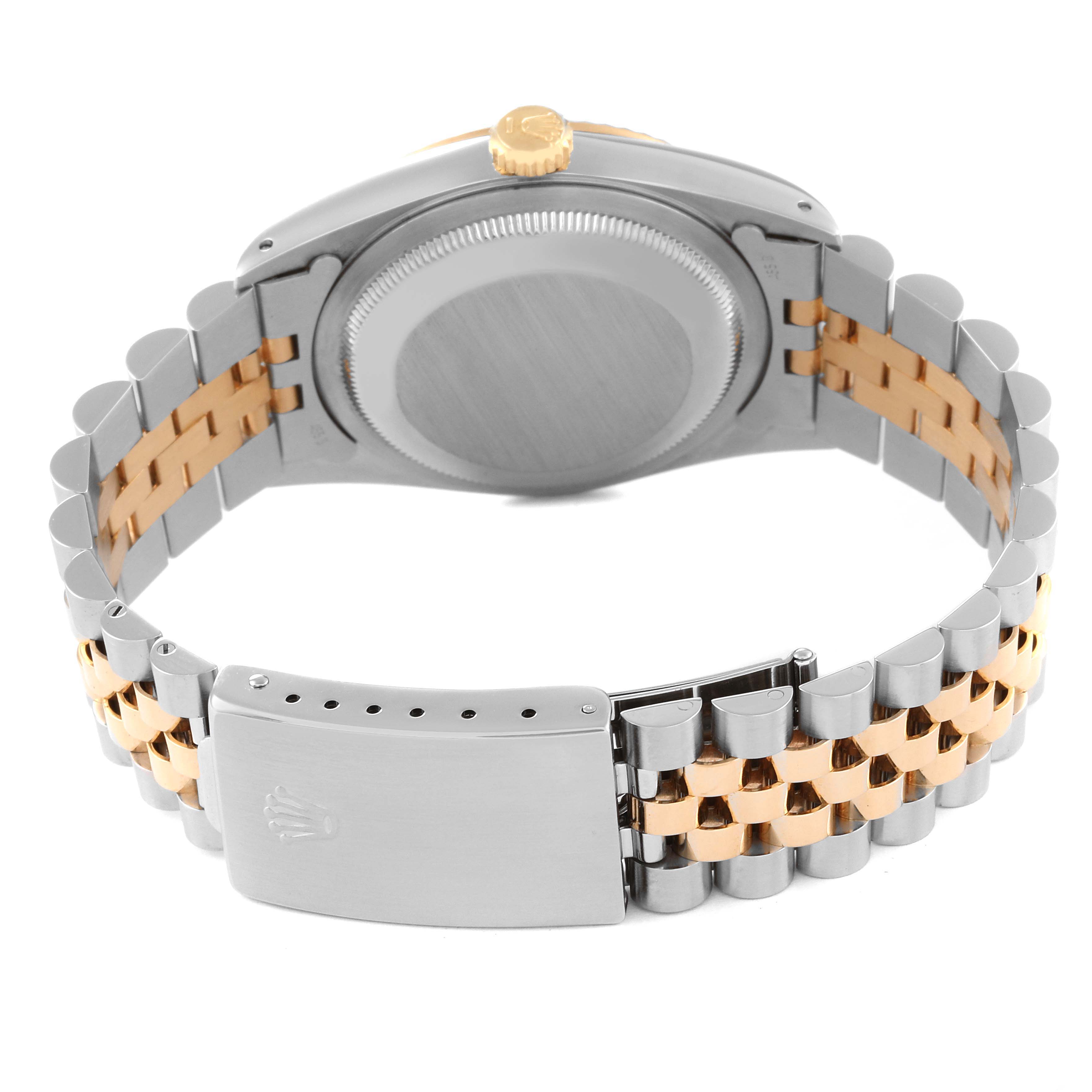 This image shows the back and bracelet of a Rolex Datejust 16233 Men's Steel and Gold (two tone) Champagne Dial 16233 Men's Steel and Gold (two tone) Champagne Dial watch, highlighting the crown and clasp.