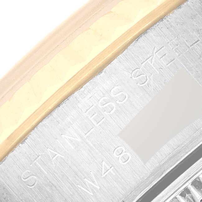 The image shows a partial close-up of the side of a Datejust Rolex watch, highlighting the engraving on the stainless steel.