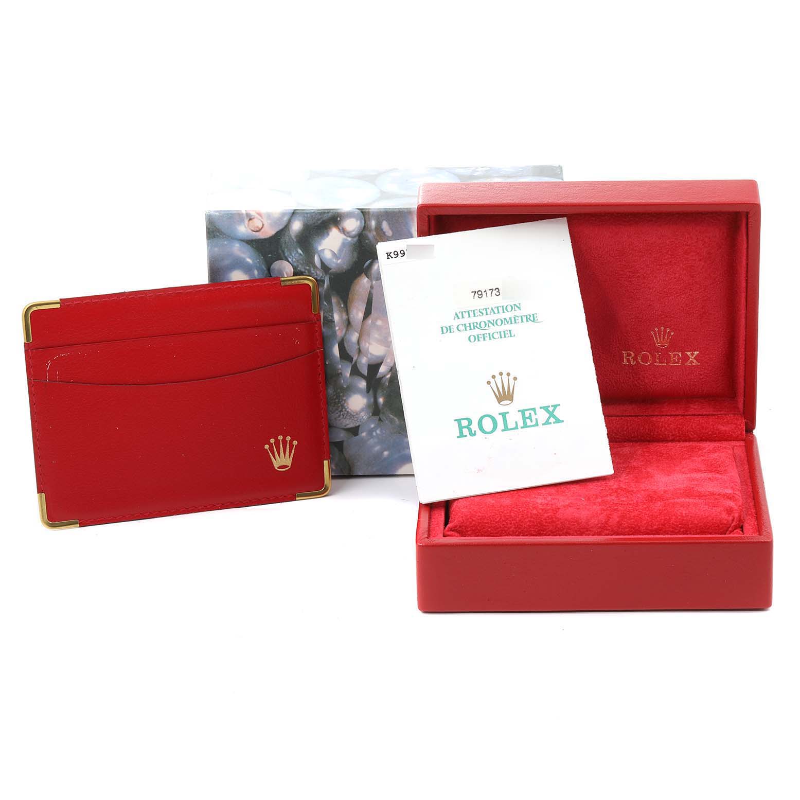 The image shows accessories for a Rolex Datejust 79173 Women
s Steel and Gold (two tone) Silver Dial 79173 Women
s Steel and Gold (two tone) Silver Dial model, including a red box, a cardholder, and a certificate.