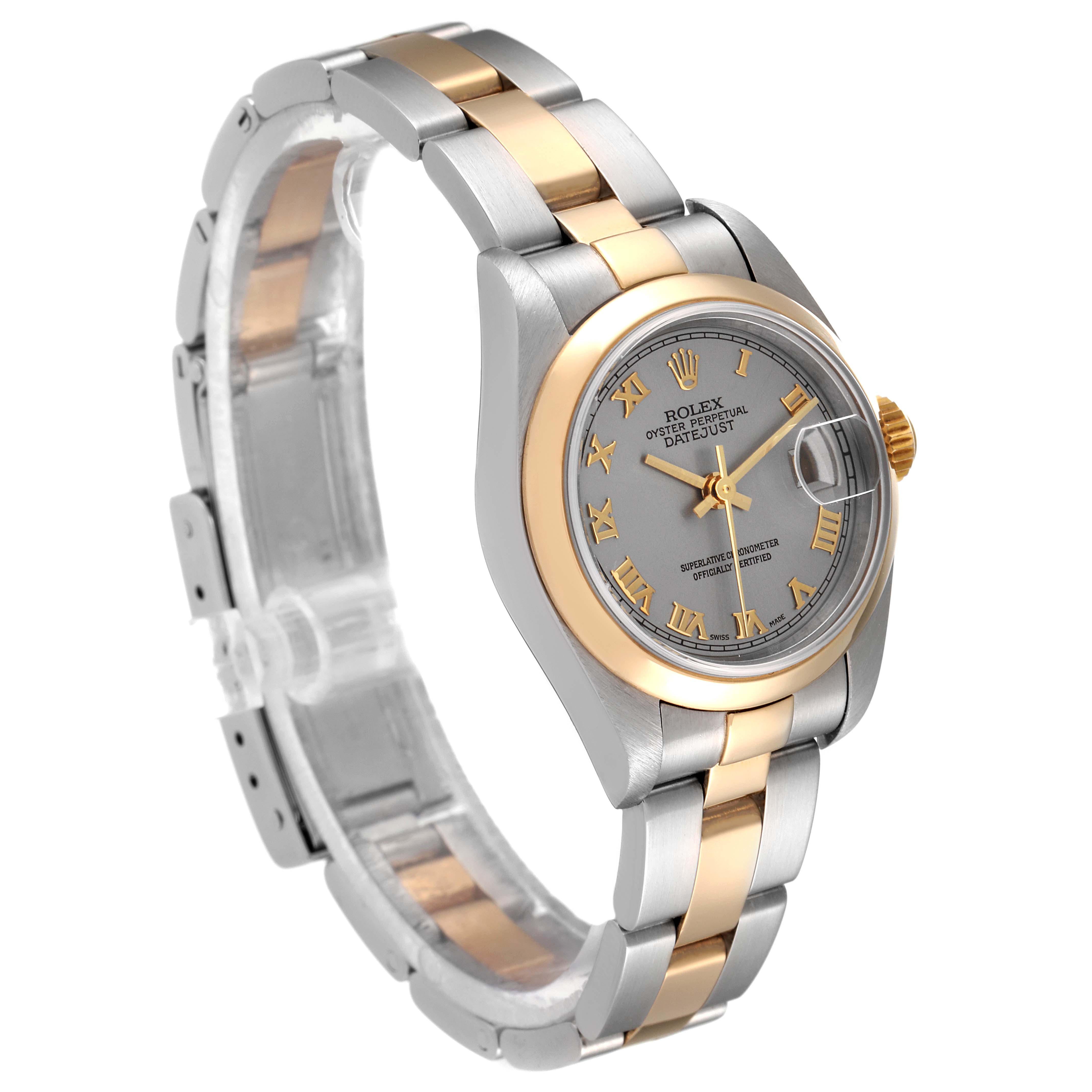 This Rolex Datejust 79163 Women's Steel and Gold (two tone) Grey Dial 79163 Women's Steel and Gold (two tone) Grey Dial watch is shown at a three-quarter angle, featuring a two-tone band and gray dial with Roman numerals.