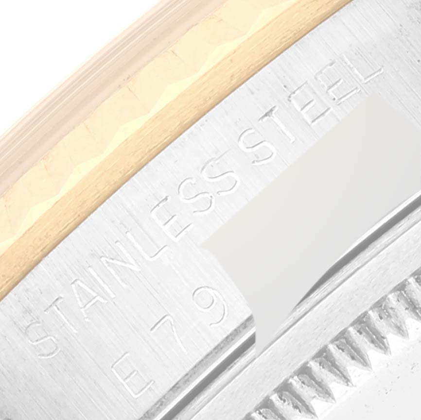 This close-up angle of the Rolex Datejust 16233 Men's Steel and Gold (two tone) White Dial 16233 Men's Steel and Gold (two tone) White Dial watch shows the engraved "STAINLESS STEEL" text on the case back.