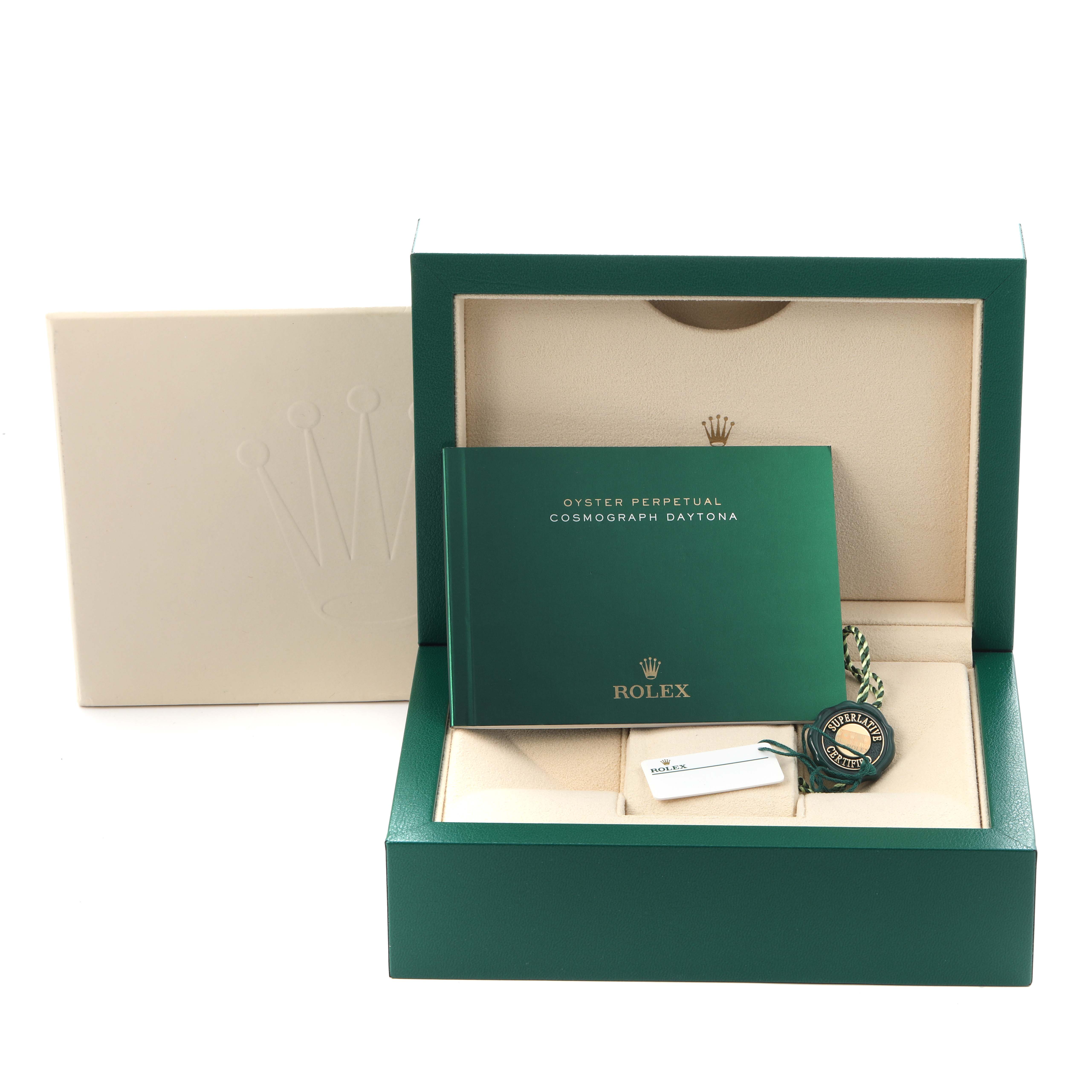 The image shows the packaging, booklet, and tag for a Rolex Daytona 116500LN Men
s Stainless Steel White Dial 116500LN Men
s Stainless Steel White Dial watch from a front angle.